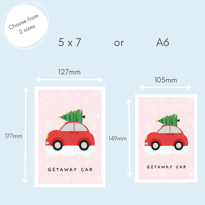 A size comparison graphic for a 'Getaway Car' photo print, showing two options: a 5x7 inch print (127mm by 177mm) and an A6 size print (105mm by 149mm). Both prints feature a pink background with white snowflakes, a red car carrying a green Christmas tree, and the text 'GETAWAY CAR'.