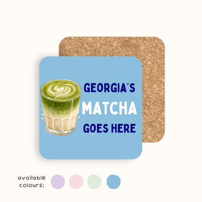 Personalised Matcha Goes Here drinks coaster with custom name, glossy finish and cork backing, available in five pastel colours.