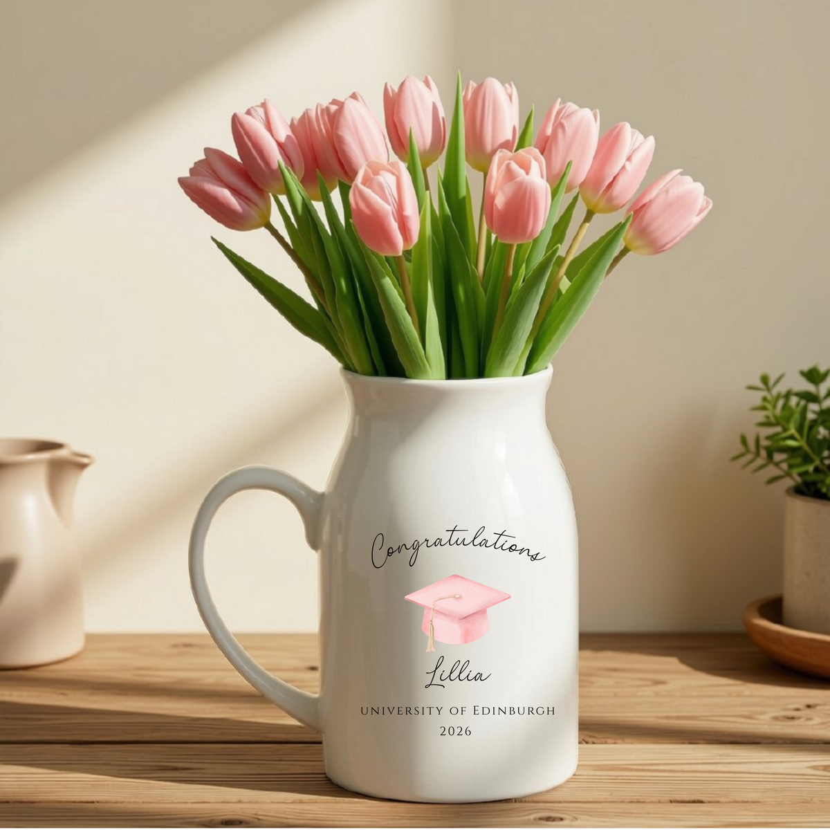 Personalised ceramic graduation vase featuring the graduate's name, university name and graduation year